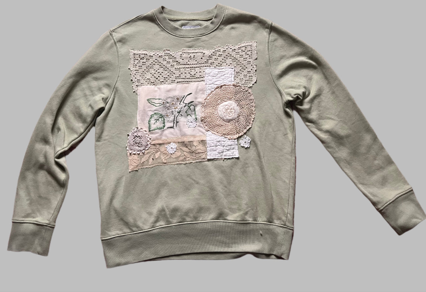 Light green crewneck with collage of vintage lace and textiles, size medium